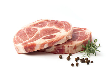 Steaks of raw marbled pork tenderloin with rosemary and peppercorns on a white background.