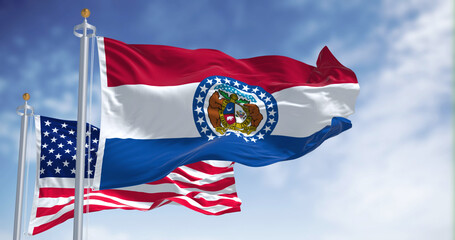 The Missouri state flag waving along with the national flag of the United States of America