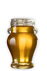 Golden honey in a bulky jar The jar has small ears
