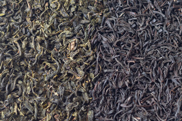 Leafy green and black tea are scattered in piles side by side