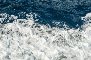 Naklejka na ściany i meble Crashing waves foam in the mediterranean sea
