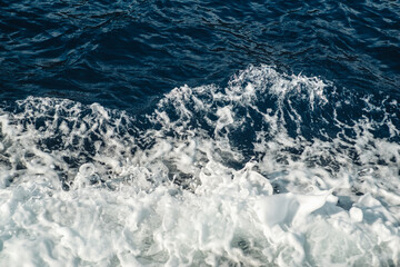 Crashing waves foam in the mediterranean sea