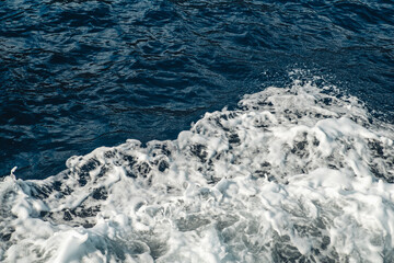 Crashing waves foam in the mediterranean sea