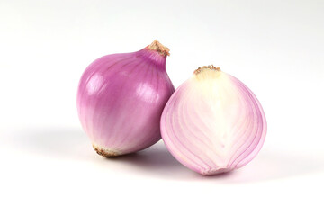 Red onion, peeled, halved, close-up placed on a white background