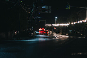 Evening view of a curved road with cars in a city