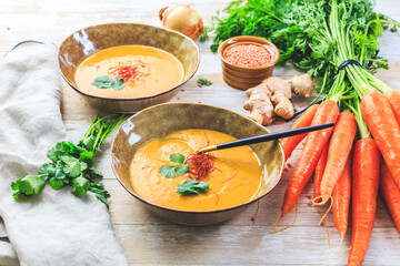Homemade red lentil soup with carrots, ginger and coconut milk