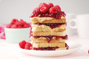 Sandwiches with peanut butter and raspberry jam