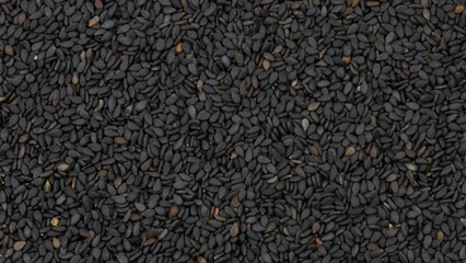 Black sesame seeds close up background