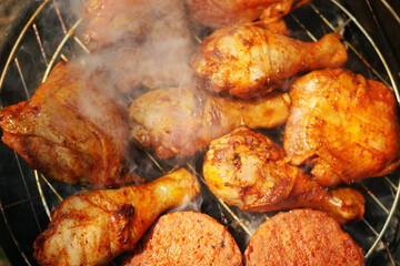 Chicken roasted on the grill. Summer barbeque concept. Smoked food top view