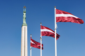 Latvia Independence Day. National Freedom Monument. Riga in Spring. Day of Restoration of Latvia’s independence - obrazy, fototapety, plakaty