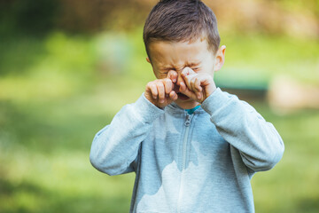 Suffering from pollen allergy. Child with pollen allergy. Spring allergy concept. Wormwood pollen...