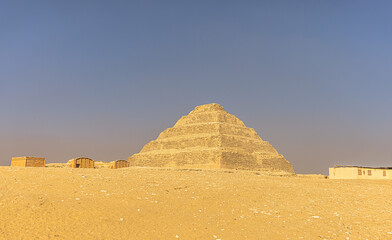 Obraz na płótnie Canvas Saqqara, Egypt - November 14, 2021: Pyramid of ancient Egyptian Pharaoh Djoser in Saqqara, Egypt