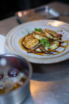 Shallow focus of Chicken Ballotine, smoked potato mash, sauteed chanterelle mushroom and veal jus