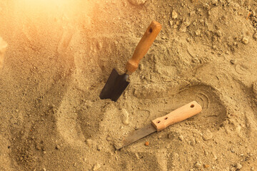 Shovel in the sand.Skeleton and archaeological tools.Digging for fossils.