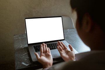 Businessman pointing to laptop