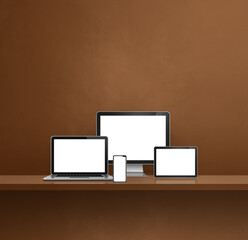 Computer, laptop, mobile phone and digital tablet pc. brown shelf background