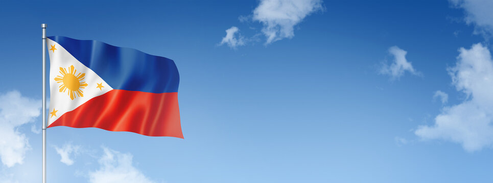 Philippines flag isolated on a blue sky. Horizontal banner