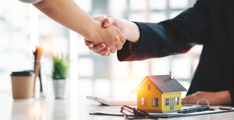 Real estate agent or realtor handshake with her client after the deal, .business people. handshake...