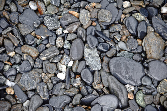 Rocks of different shapes and colors covering the gerund
