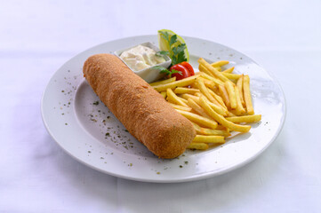 Karadjordjeva snicla with potato chips served on a plate