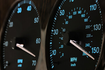 Fototapeta speedometer in car dashboard at full speed in illuminated night mode obraz