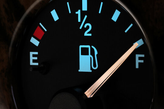 fuel gauge in car dashboard in illuminated night mode  - full