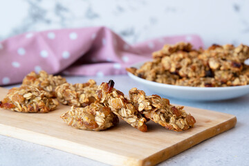 Banana and oatmeal cookies on the board. Side view. selective focus