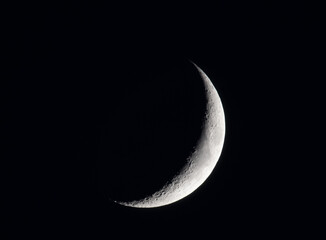 Fascinating shot of a new moon on the dark sky