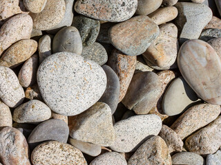 Closeup shot of the details of amount of small stones in the sunlight