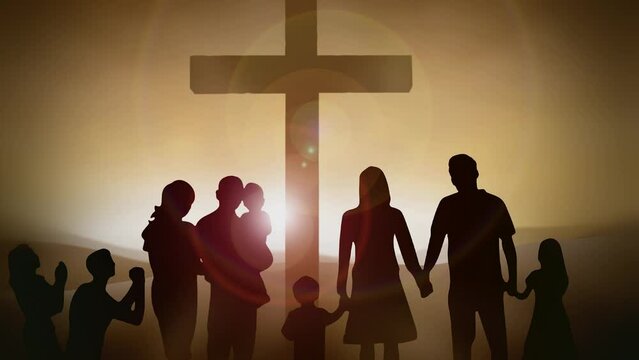 Closeup of a family standing near the cross during sunrise
