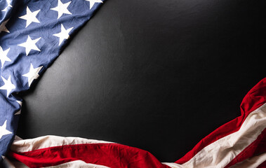 Fototapeta premium Happy memorial day concept made from American flag on dark wooden background.