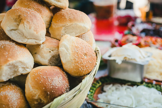 Cemita poblana bread in a wicker basket at a market