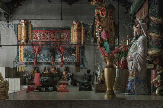 Bangkok, Thailand - Apr 29, 2022 : Architecture interior of Traditional chinese shrine and Chinese god statues on Chinese altar table at Phutthamonthon sathan or Sun wukong shrine. Selective focus.