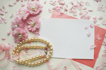 postcard mockup. frame of pink sakura flowers and white blank for text. wedding card. invitation