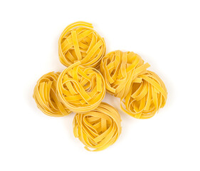 Italian pasta fettuccine nest on white background. Top view