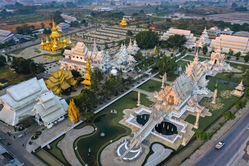 Aerial view of Wat Rong Khun, the white temple, at sunrise, in Chiang Rai, Thailand - obrazy, fototapety, plakaty