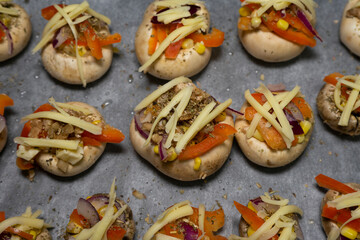 Stuffed mushrooms on baking paper