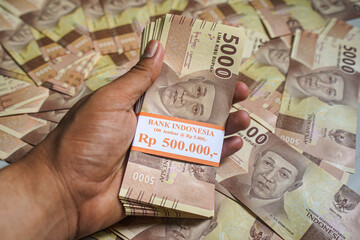 Money in the form of a rupiah Indonesia "Rp5000"