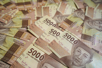 Money background. Cash money with the amount of five thousand rupiah "Rp5.000". The official currency of Indonesia from Bank Indonesia. 