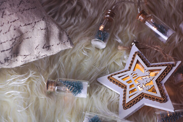 New Year's mood with stars on a fur carpet.