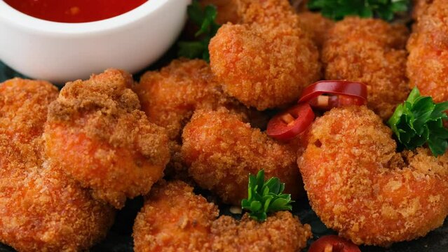 Crispy Prawns in breadcrumbs with sweet chilli sauce. rotating video