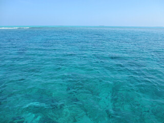 Fototapeta na wymiar Blue background. The texture of the water. Indian Ocean.