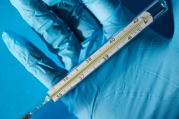 Termometer in a hand of a doctor