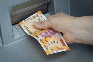 Indian rupees withdrawn from the ATM, Financial and economic concept related to inflation and...