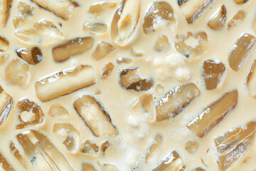 Coffee and ice texture,Close-up of Cold latte drink with ice cubes,