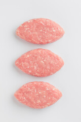 Raw meat cutlets isolated on a white background