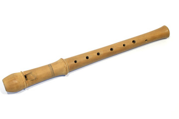 Single brown wooden flute. Wind musical instrument, melody control with finger isolated on the white background. Mouthpiece instrumental music