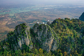 Aerial view of Wat Chaloem Phra Kiat Phrachomklao Rachanusorn, sky pagodas on top of mountain in Lampang Thailand