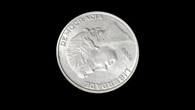 Rotating reverse of Portugal coin 25 escudos 1980. Isolated in black background.