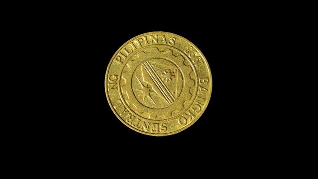 Rotating reverse of Philippines coin 25 sentimo 2001. Isolated in black background.